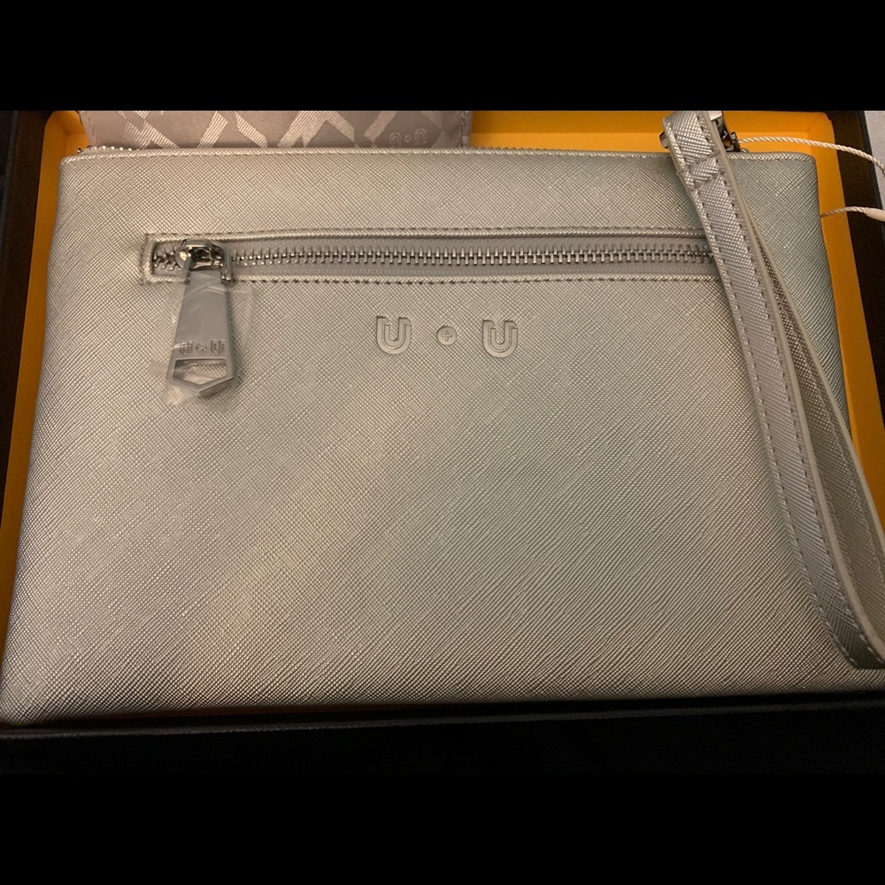 Silver Leather wristlet with built in phone charger perfect little bag